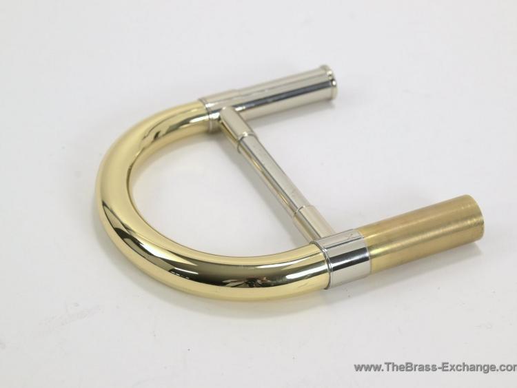 S.E. Shires TYX tenor trombone tuning slide in yellow brass with nickel-silver brace  002 — Front view of S.E. Shires TYX Custom Series tenor trombone tuning slide  003 — S.E. Shires TYX tuning slide showing open receiver tubes and nickel-silver cross brace  004 — Side view of S.E. Shires TYX demo tuning slide showing light cosmetic wear on brace