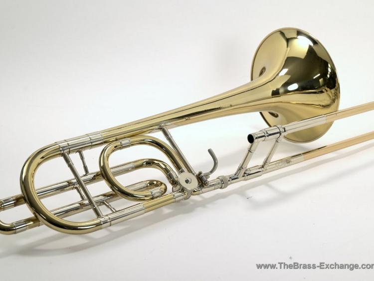 Conn 72H vintage Elkhart bass trombone side view showing bell, single rotor, F-attachment wrap, and handslide