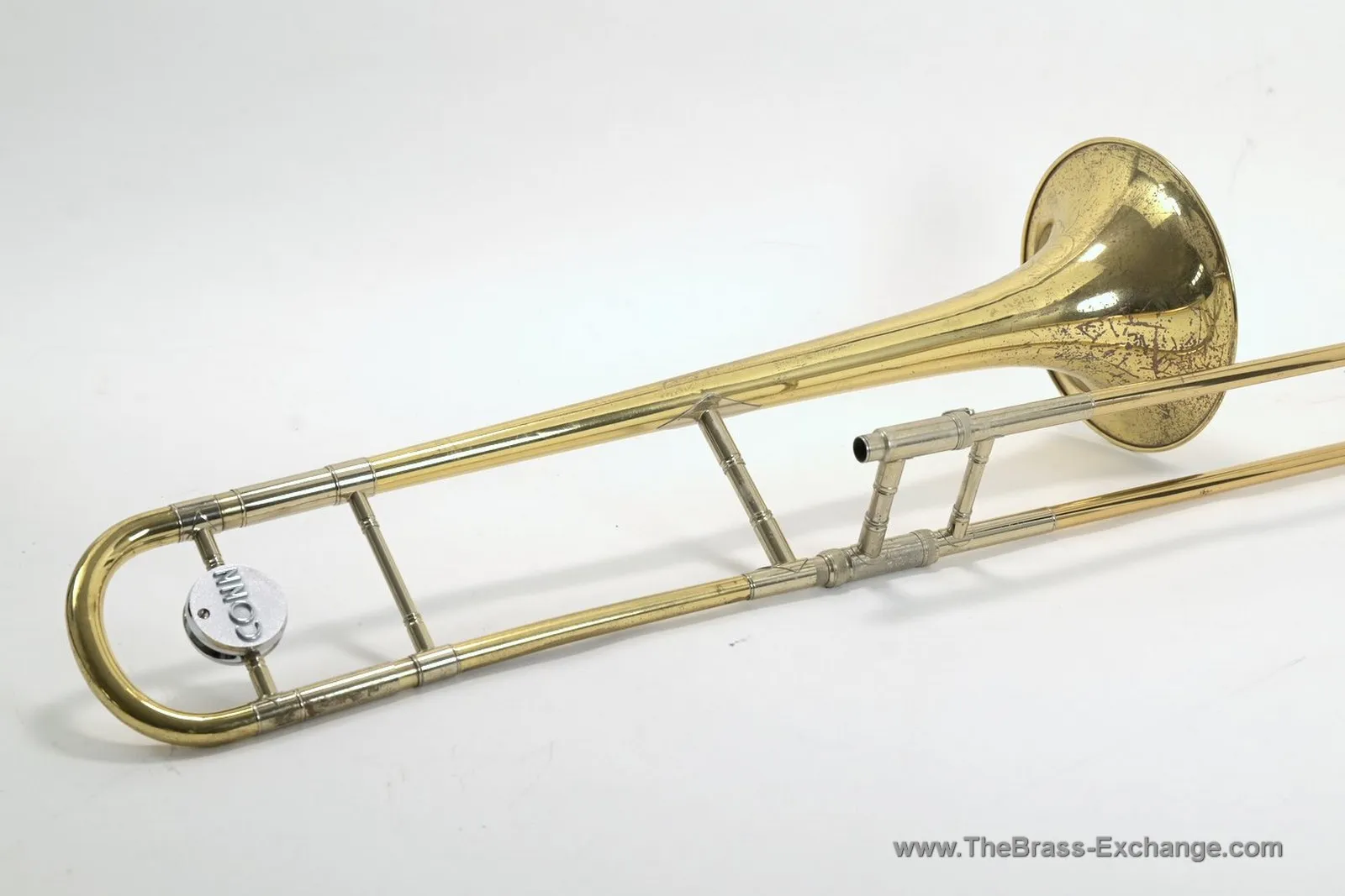 Conn 6H Elkhart tenor trombone side view showing bell section, tuning bow, Conn counterweight, and handslide