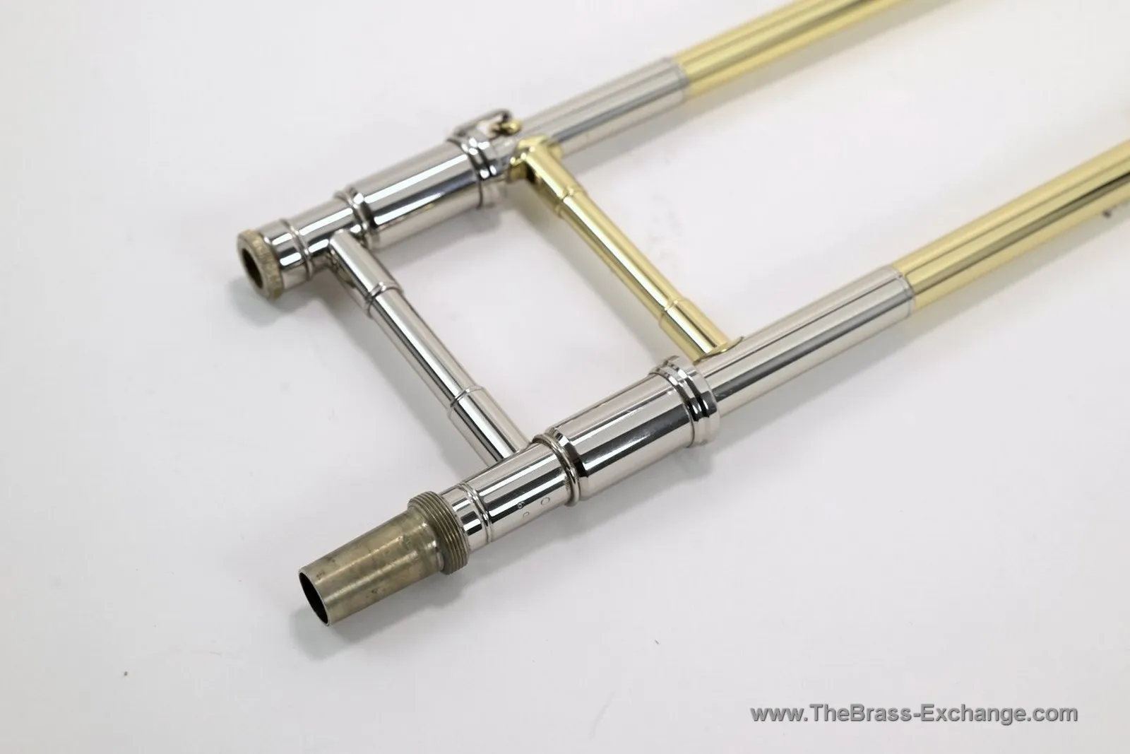 Edwards dual-bore tenor trombone slide showing threaded bell connection, braces, and slide lock