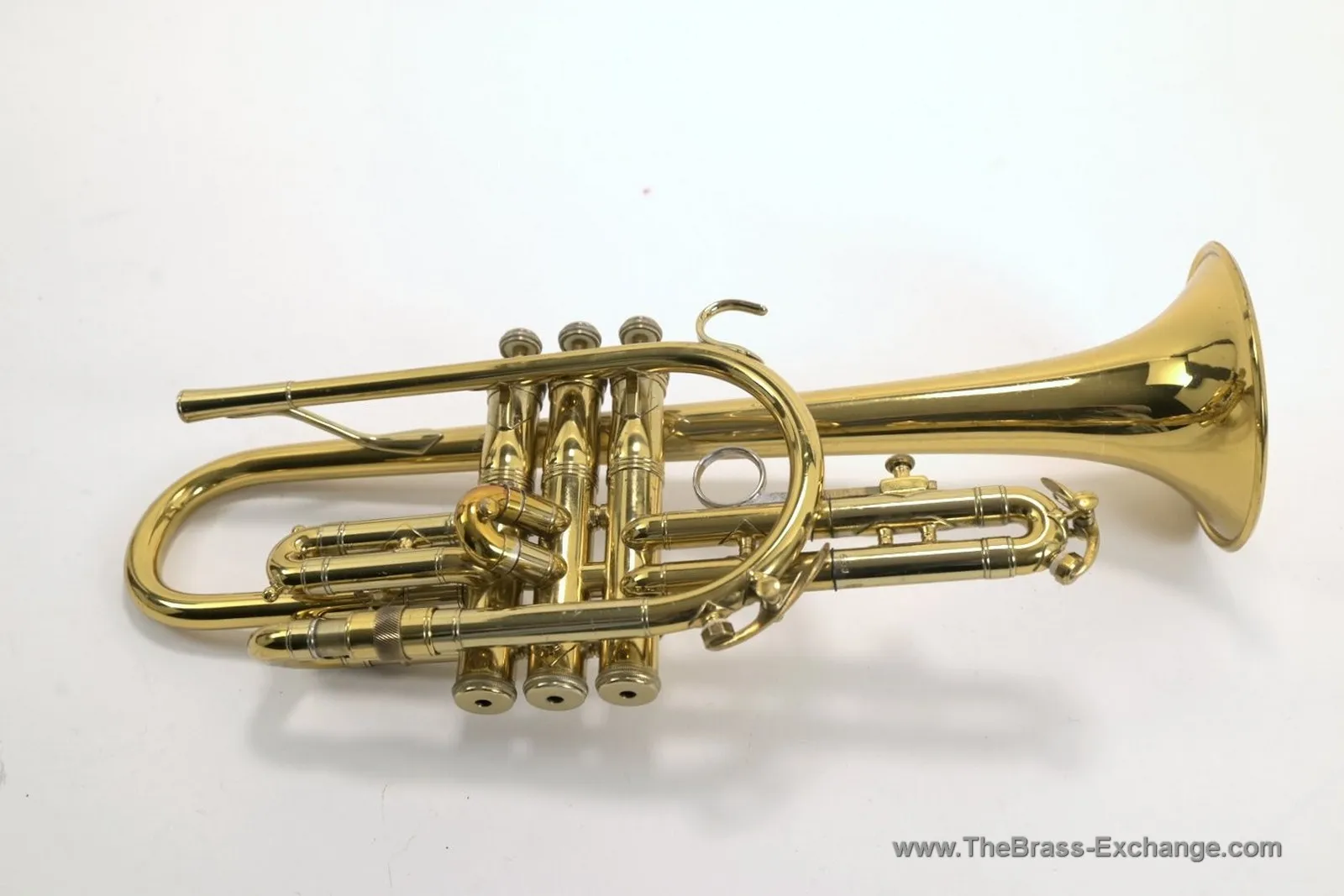Side view of King Master Super 20 cornet showing piston valves, underslung tuning slide, and brass bell
