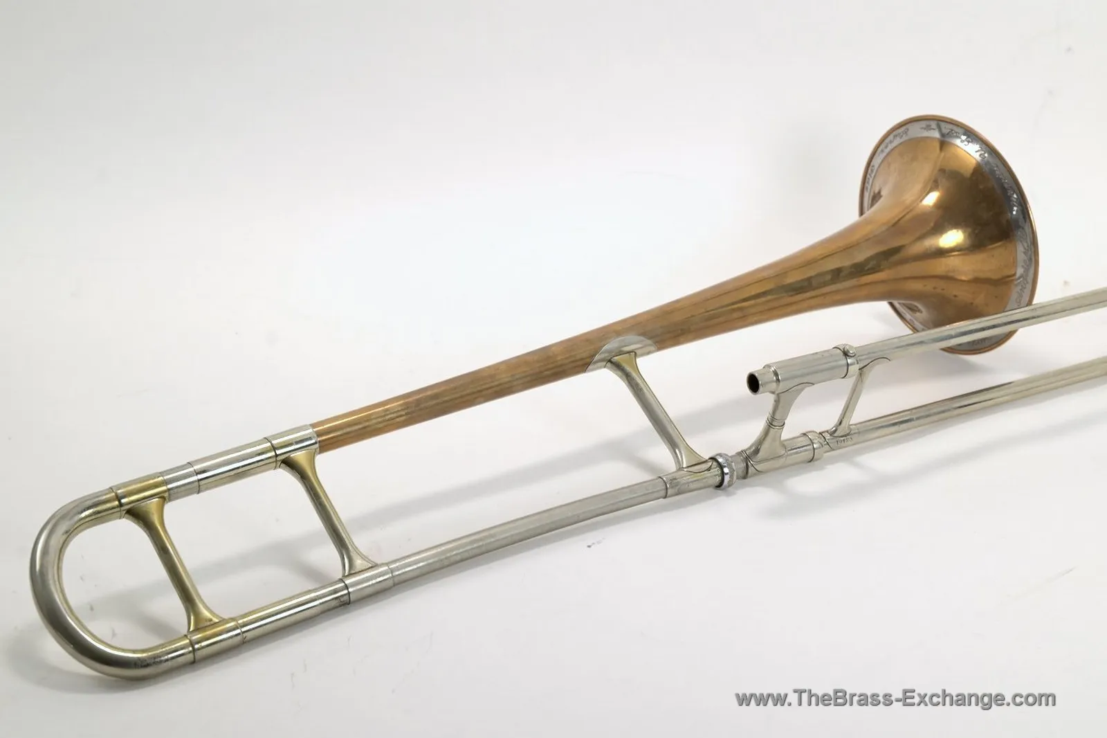 Olds Super Los Angeles trombone side view showing bell exterior, engraved rim band, tuning bow, and handslide